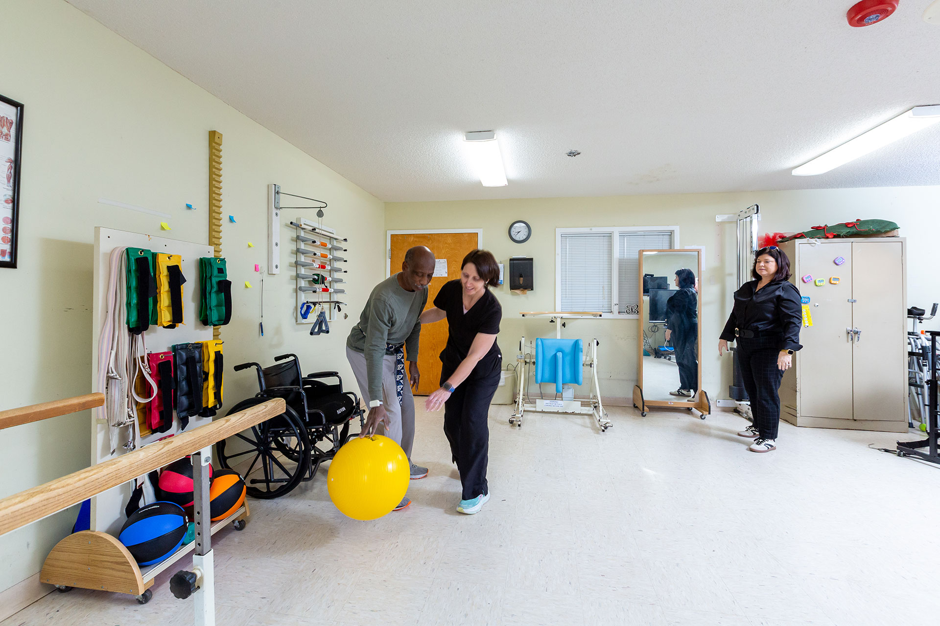Therapy session with individuals engaging in rehabilitation exercises.